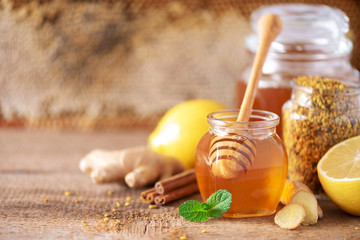 Alternative medicine concept. Ingredients for flu fighting natural hot drink. Copy space. Lemon,...