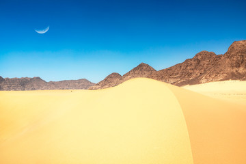 Fototapeta na wymiar Moon shaped sand dune at Wadi Rum White Desert