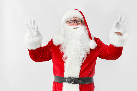 Happy Santa Claus showing OK gesture on white background