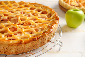 Tasty apple pie on table, closeup