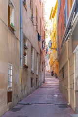 Nice in France, small street with typical colorful facade in the old town