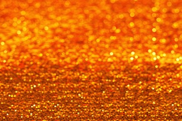 Gold Festive Christmas background. Elegant abstract background with bokeh defocused lights 