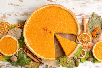 Composition with tasty pumpkin pie on wooden background