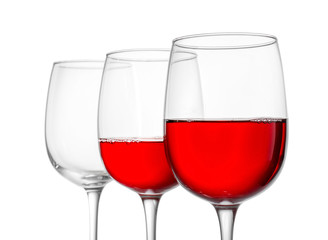 Glasses of wine on white background