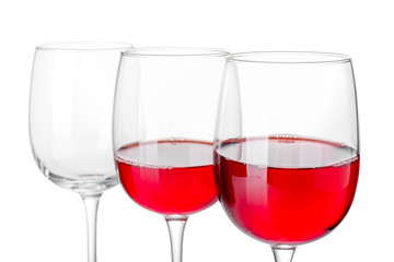 Glasses of wine on white background