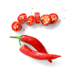 Cut and whole chili peppers on white background
