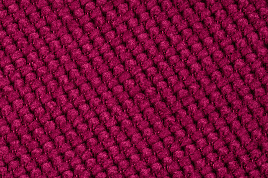 Dark red background from a textile material.