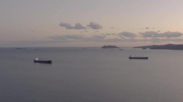 General cargo ships at the anchorage in the evening, Far East, Russia