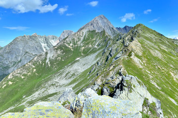 large view on rocky peaks mountain under blue sky