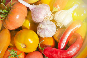 fresh vegetables from the garden - tomatoes, garlic and peppers.