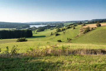Fototapeta na wymiar Panoramic view of pond named River and surrounding meadows and woods