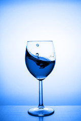 Glass with water up and splash