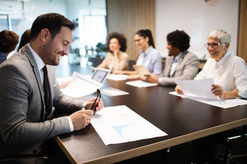 Business colleagues having meeting in conference room in office