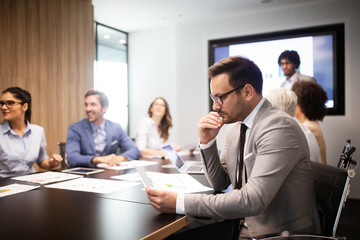 Group of successful business people at work in office