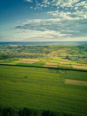 Obraz premium Aerial view of the green and yellow rice field, grew in different pattern at sunset.