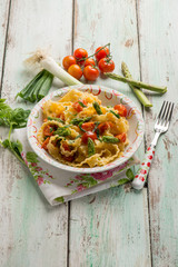 mafalda pasta with asparagus tomatoes and leek