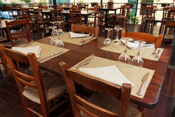Restaurant of cafeteria terrace with classic style furniture. Southern Italy restaurant terrace on street in morning time with no people.