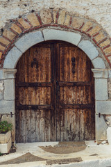 Fototapeta na wymiar The background old, stone wall with wooden retro door