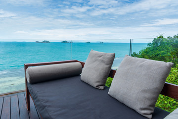 Fototapeta na wymiar sofa and pillow on platform by the sea.