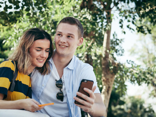 Happy couple selfie photo together by smartphone.