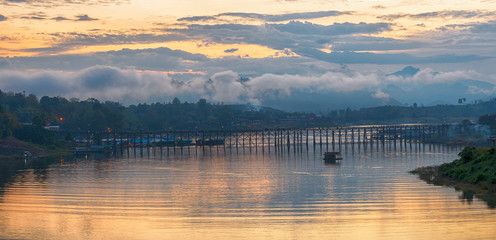 Panorama of beautiful sunrise scene at old an long wooden bridge at Sangklaburi,Kanchanaburi province, Thailand