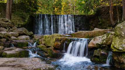 Wild Waterfall in beautiful scenery of Karkonosze Mountains in Karpacz, Poland 