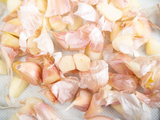 Peeled garlic on cutting board,Food,Raw material,Bad smell,Turned with a knife,Closeup,Cooking,tasty