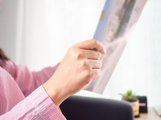 Woman reading a book,concepts of home and comfort,Background,On hand