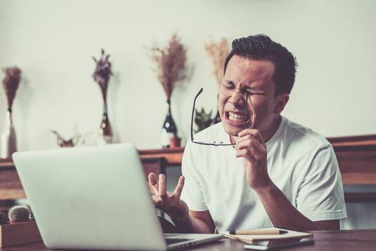  Businessman having a headache,bad mood failed and has problem, stress and depression.