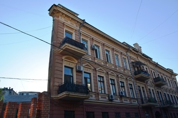 Fototapeta na wymiar Odessa, Ukraine, 08/25/2015. Rafalovich apartment house, House-wall, flat house, on the city street by the sea