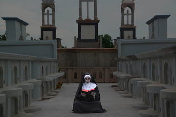Rendering of a ghost nun or demon in the dark mysterious at the Churchyard.