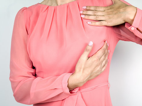 Breast health concept. Woman taking self examination using hands