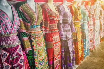 The Hmong hill tribe dress for tourist to try on for picture (very common dress , every where we...