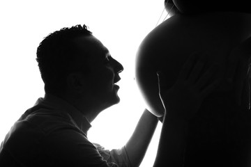 silhouette of man and woman during pregnancy