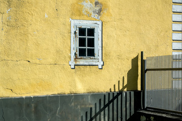 House wall with old window.