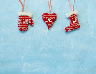 Christmas decorations hanging on a blue background. - 290691744