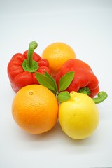 oranges and green leaves isolated on white background