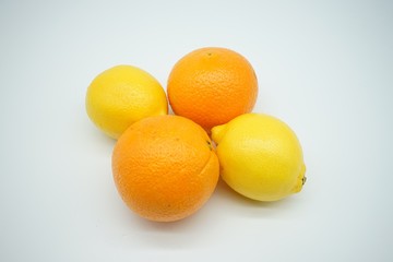 oranges and lemons on white background