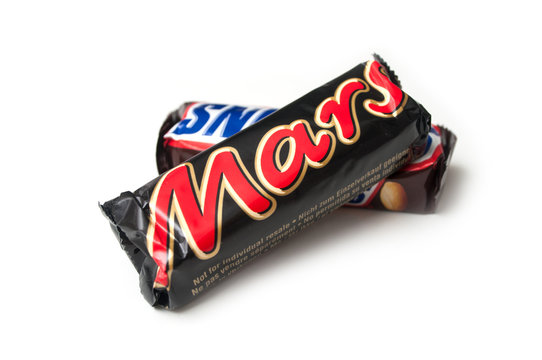 Mulhouse - France - 19 September 2019 - Closeup Of Mars And Snickers Chocolate Bar On White Background