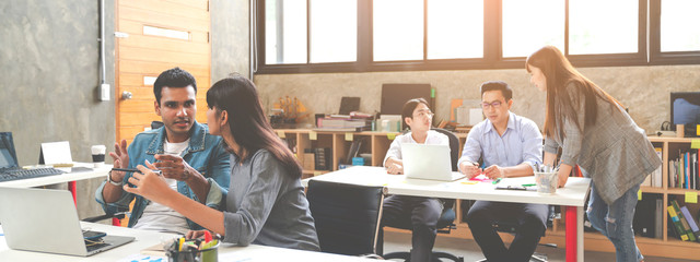 Banner of asian happy business creative team in routine work creative lifestyle sitting and talking together at modern office. Diverse teamwork or employee brastorming concept.
