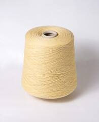 bobbin of yarn on a white background. Side view.Textile reel on isolated white background.