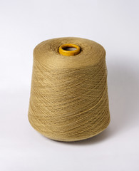 bobbin of yarn on a white background. Side view.Textile reel on isolated white background.