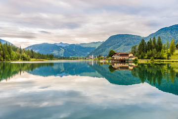 View at the Pillersee lake with St.Ulrich village in the late - Austria