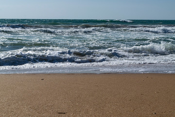 Black Sea. Summer storm. Waves lapping at the sandy beach.