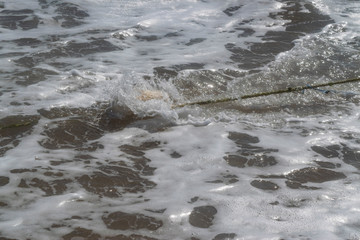 Black Sea. Summer storm. Waves lapping at the sandy beach.