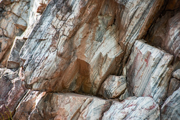 Uneven ledges of marble wall