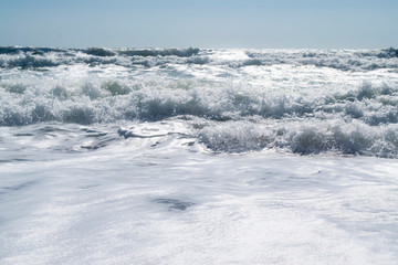 Black Sea. Summer storm. Waves lapping at the sandy beach.