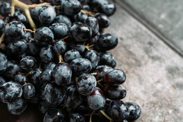 Ripe grape on the rustic background. Selective focus. Shallow depth of field.