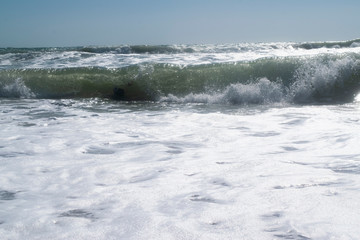 Black Sea. Summer storm. Waves lapping at the sandy beach.