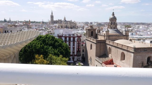 Reveal of Seville, Spain cityscape including the iconic Cathedral on a sunny summer day